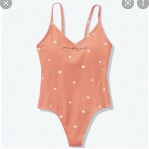 Pink VS You’re doing great bodysuit size large. Tried on but never worn.